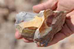 Closeup photo of a hand-sized piece of Wonderstone with a variety of colors